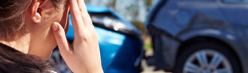 Woman looking at a car accident